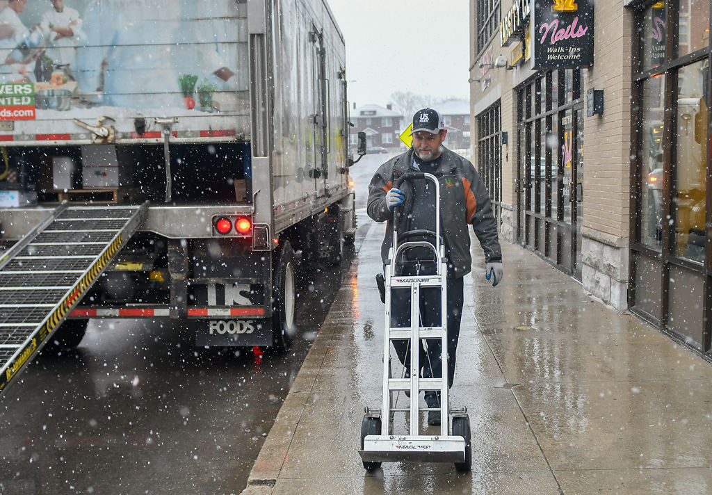Kevin Renzelman delivers packages to Bambino's Italian Cafe